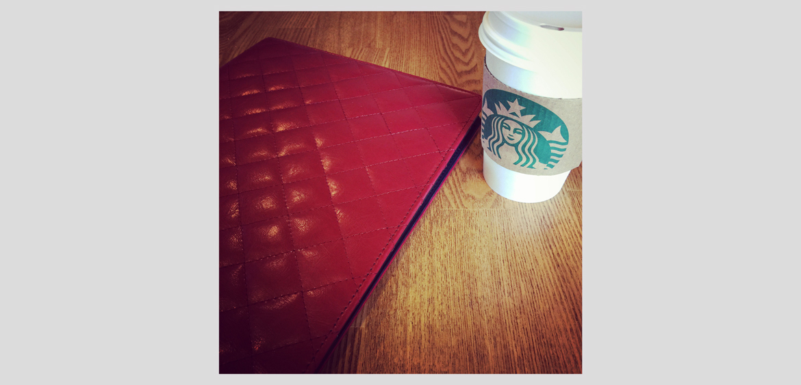 fingerprint design's photo of her sketchpad and coffee at a client meeting