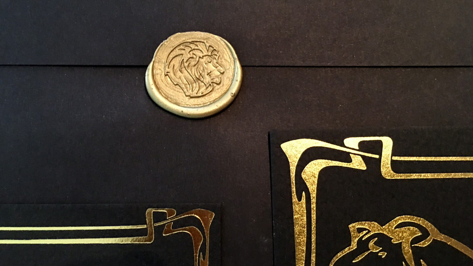 fingerprint design's closeup photo of The Regal Gold Foil Lion Wedding Suite