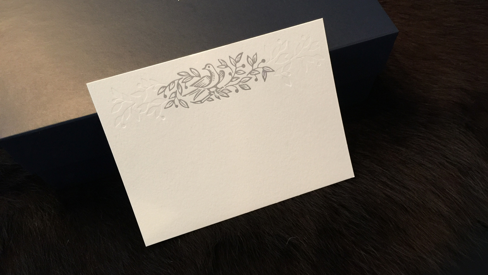 fingerprint design's photo of letterpress one color and blind emboss stationery