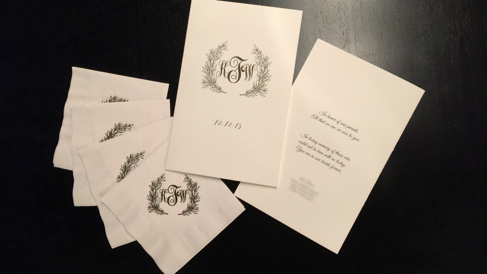 fingerprint design's photo of Katie's custom illustrated wedding programs and napkins